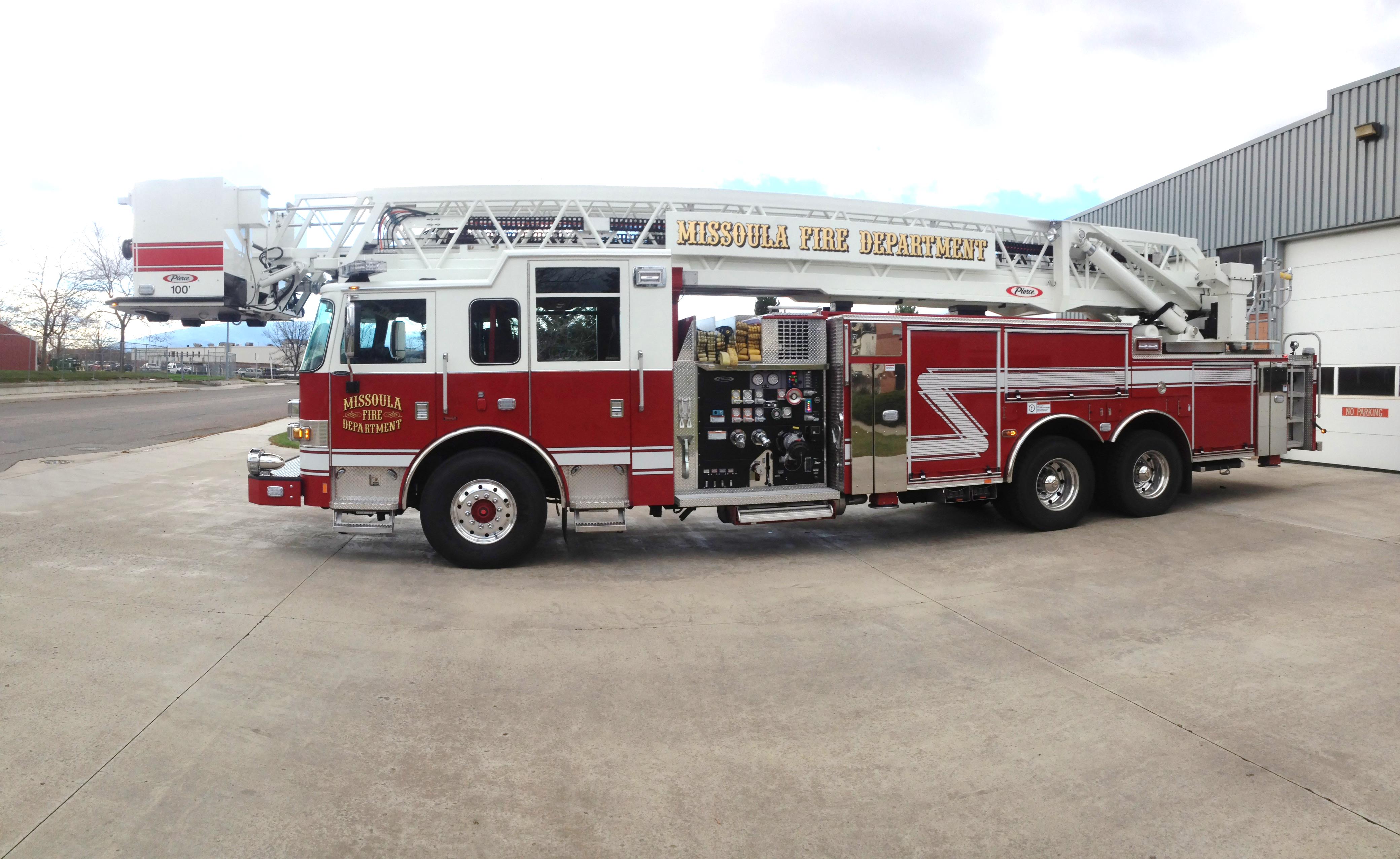 MFD red ladder truck staged outside Station 4.