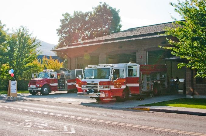 Fire Engines parked in front of a station