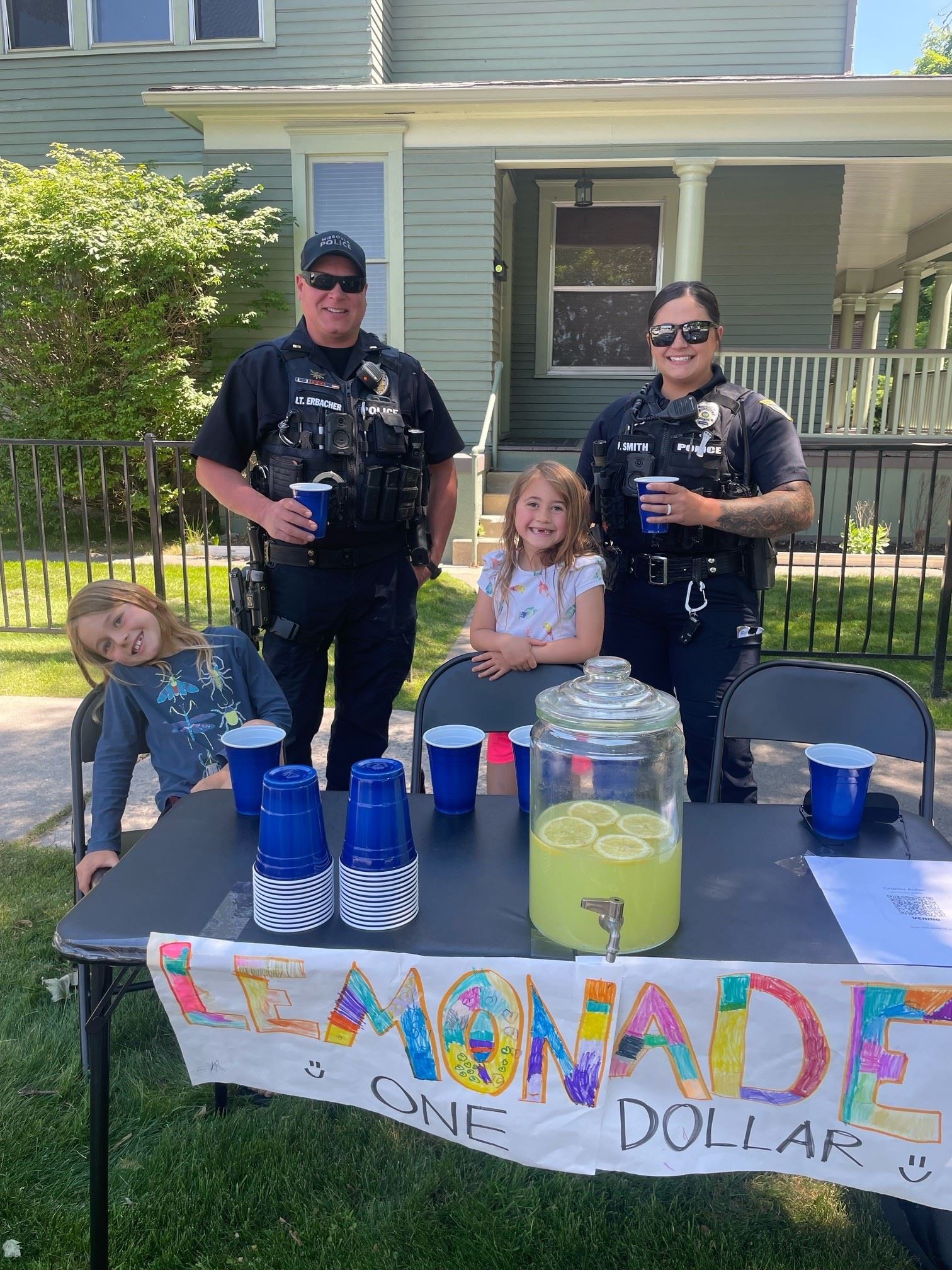 Officers Erbacher and Smith supporting a local neighborhood lemonade stand 