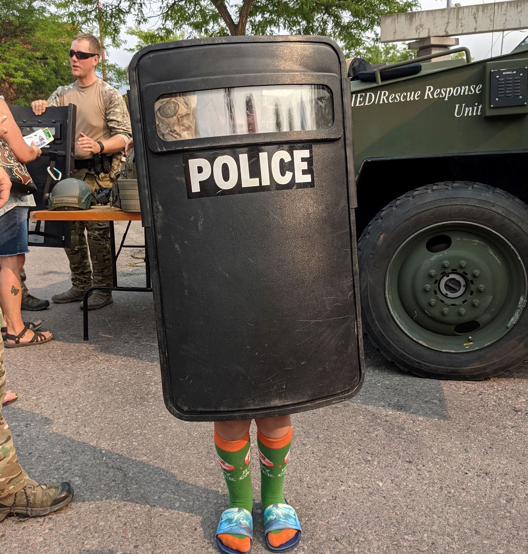 Kid with SWAT shield at National Night Out Event