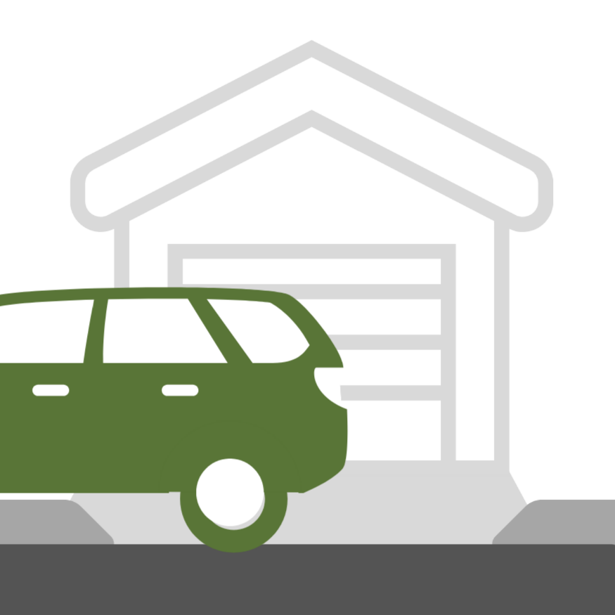 A vehicle is parked in front of a driveway to a garage